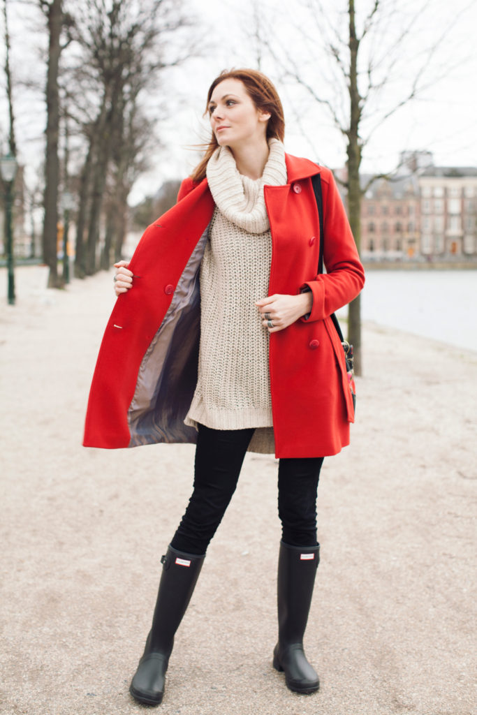 strolling the city in a red peacoat