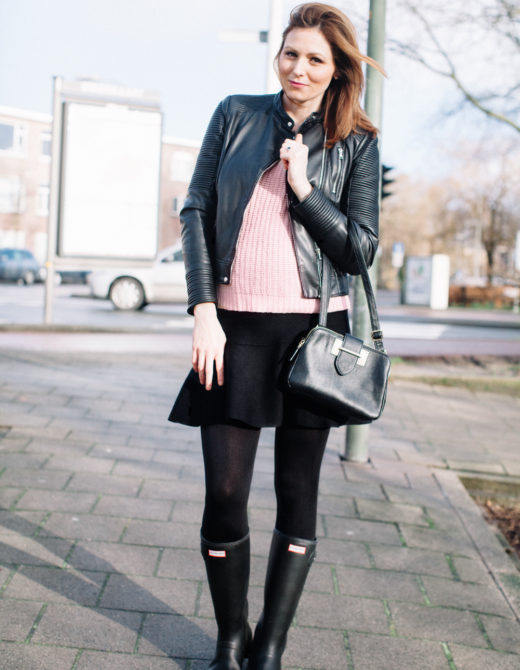 Black and Pink Outfit for Fall featured by top US fashion blog, Tea Cups & Tulips: image of a woman wearing Black leather jacket and light pink sweater