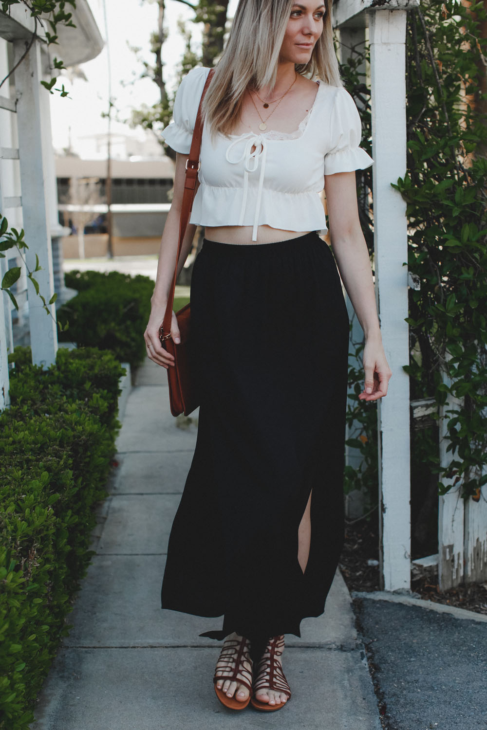 Black maxi skirt with 2 slits and a white crop top