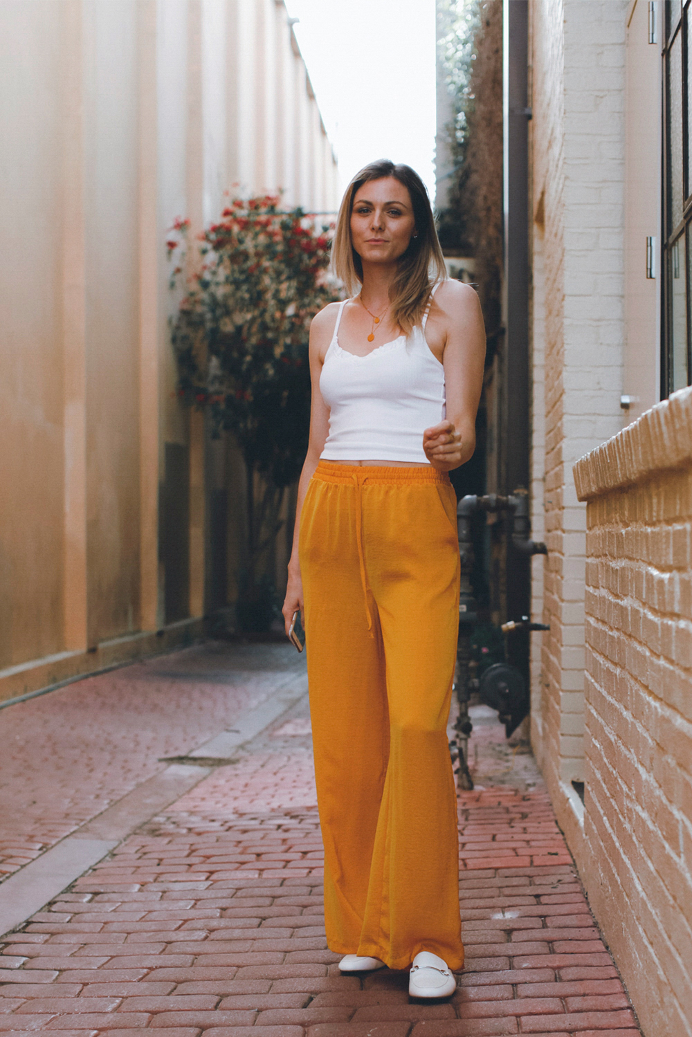 Satiny wide leg pants in mustard color