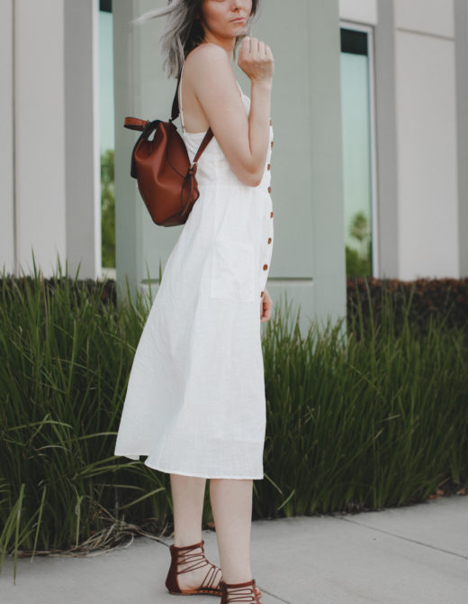 Casual outfit featuring a white midi dress and brown accessories