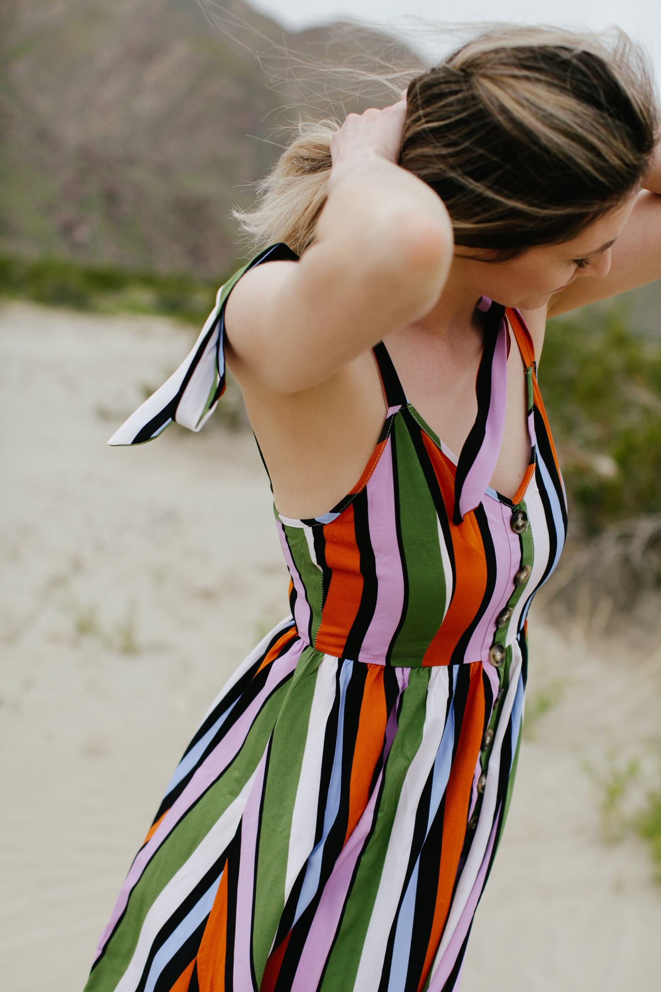 5 Casual Striped Summer Midi Dresses to Wear this Season featured by top US fashion blog, Tea Cups & Tulips: image of a woman wearing a ASOS striped midi dress