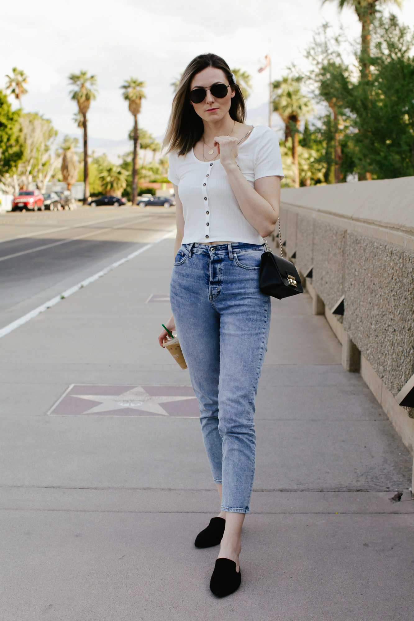 How to wear mom jeans, styling tips featured by top US fashion blog, Tea Cups & Tulips: image of a woman wearing H&M high waisted mom jeans, H&M ribbed top, A New Day pointy mules, Fulra bag, Amazon SOJOS aviator sunglasses and Amazon pearl hair clip.
