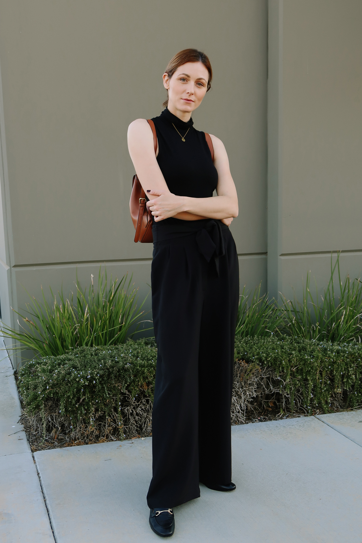 Wide-leg trousers casual outfit | Easy Casual Outfits To Try Right Now by popular California fashion blog, Tea Cups and Tulips: image of a woman outside wearing an Asos top, SheIn Paperbag Waist Slant Pocket Wide Leg Pants, and Amazon Happiness Boutique Circle Necklace.