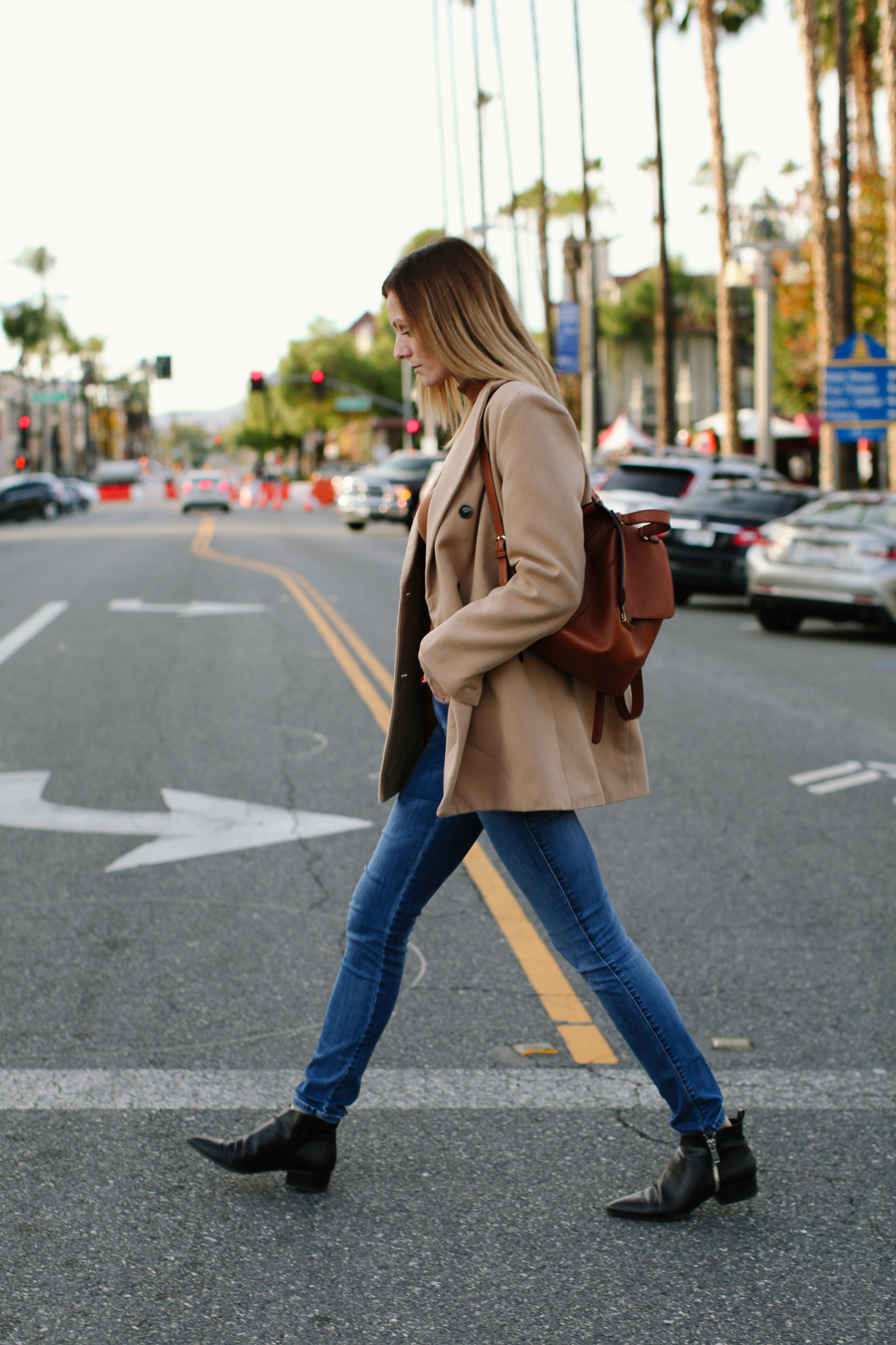 Affordable Camel Coat Picks Under $100 | Affordable Camel Coats by popular Los Angeles fashion blog, Tea Cups and Tulips: image of a woman wearing a SheIn Camel Double Breasted Coat With Welt Pocket, brown Target turtleneck, Diesel jeans, and Mango Zipped detail ankle boots.